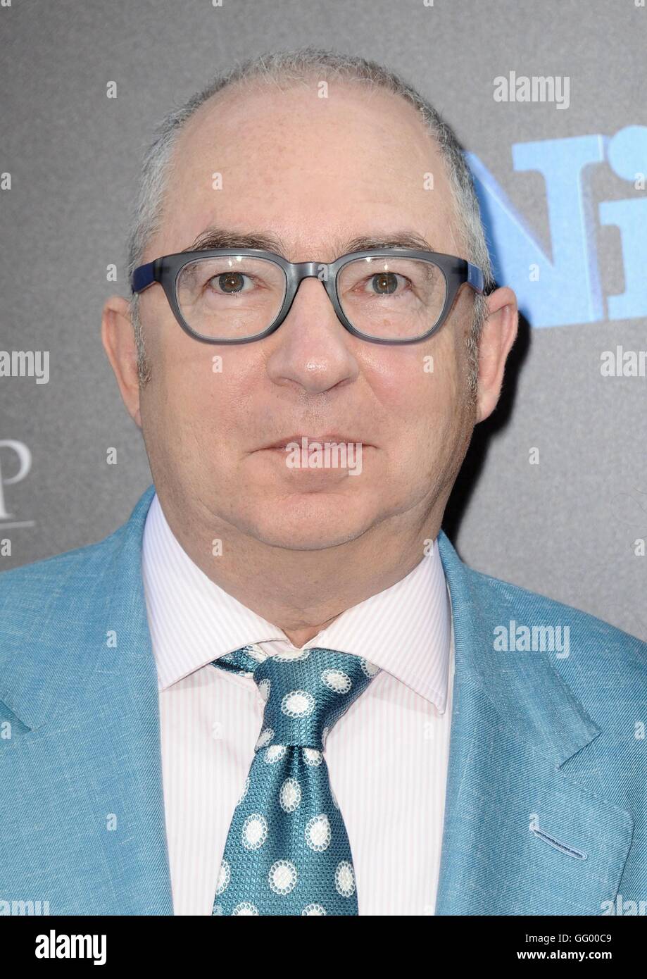 Barry Sonnenfeld arriving at an event, exuding a mix of confidence and mischief