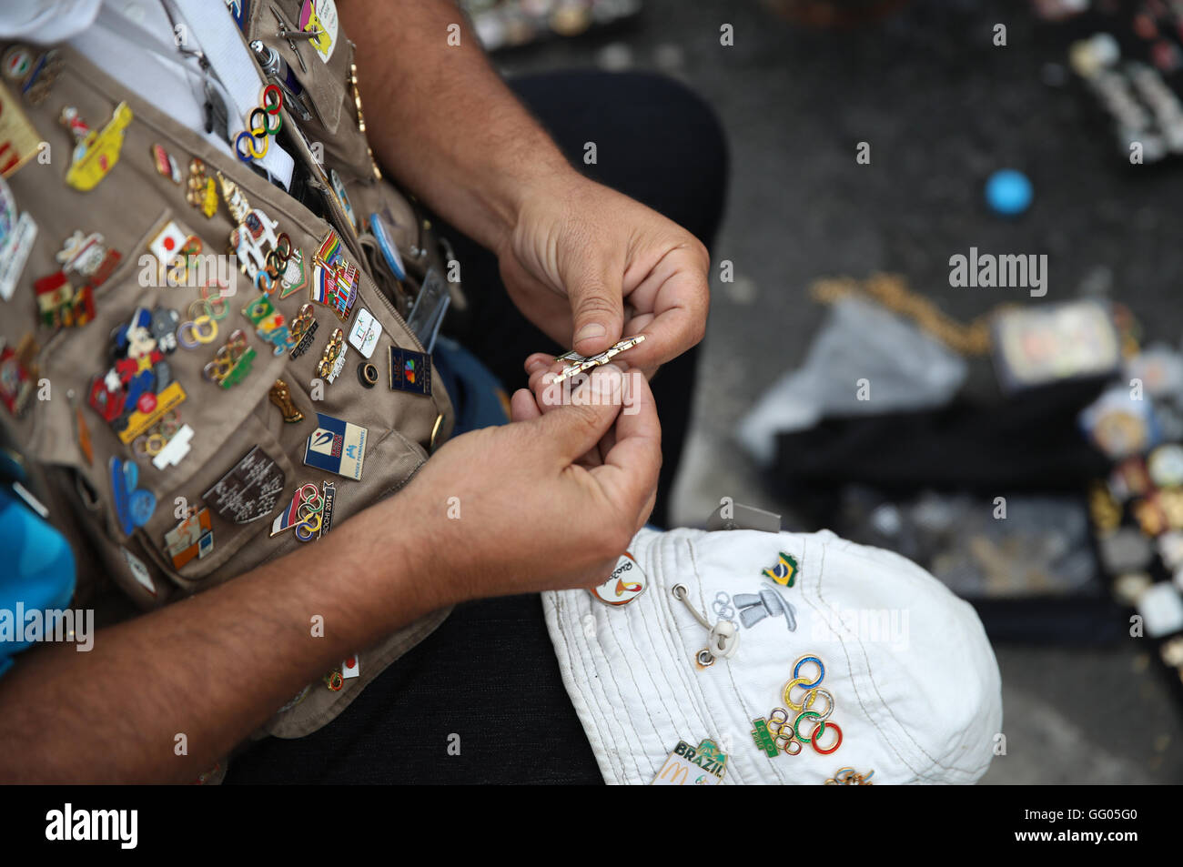 Barra, Rio de Janeiro, Brazil. 02nd Aug, 2016. Olympic pin trader Johnny Ioanidis of Greece presents his collection of pins near the Olympic Park in Barra, Rio de Janeiro, Brazil, 02 August 2016. Rio 2016 Olympic Games take place from 05 to 21 August. Photo: Friso Gentsch/dpa/Alamy Live News Stock Photo