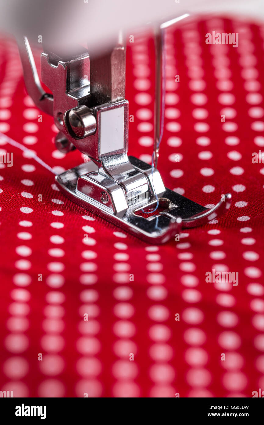 Sewing machine presser foot with threaded needle Stock Photo Alamy