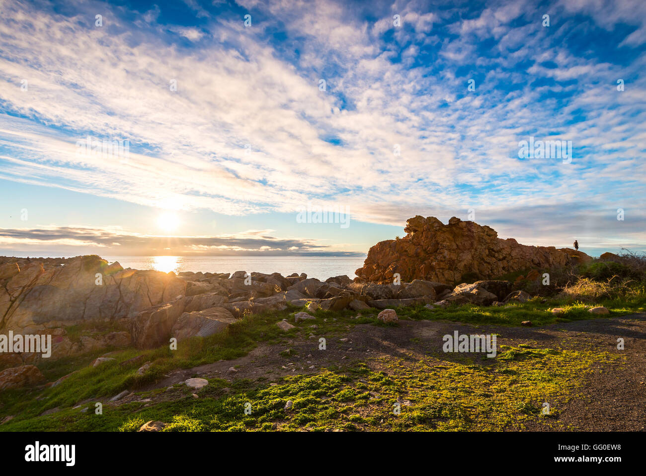 Dramatic sunset with lens flares above sea, South Australian shores Stock Photo