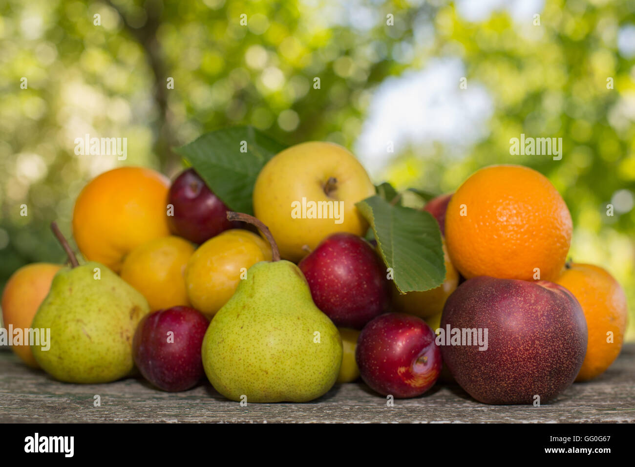 fruits in wooden table, outdoor Stock Photo - Alamy