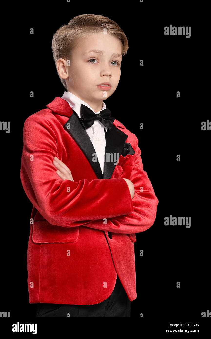 serious little boy in a tuxedo Stock Photo Alamy
