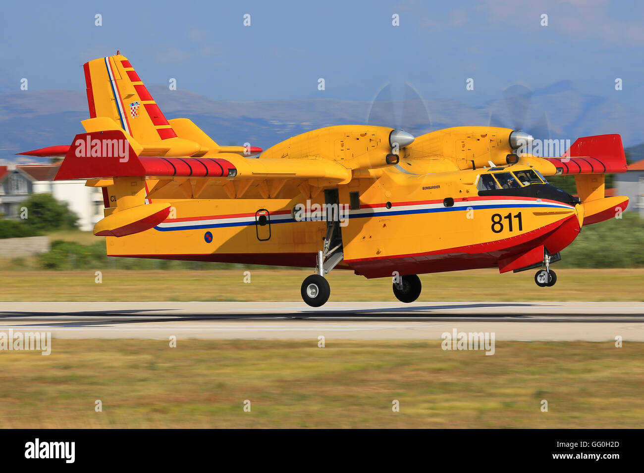 Split/Croatia July 22, 2014: Canadair CL-415 from Croatia - Air Force landing after fighting against a fire at Split Airport. Stock Photo