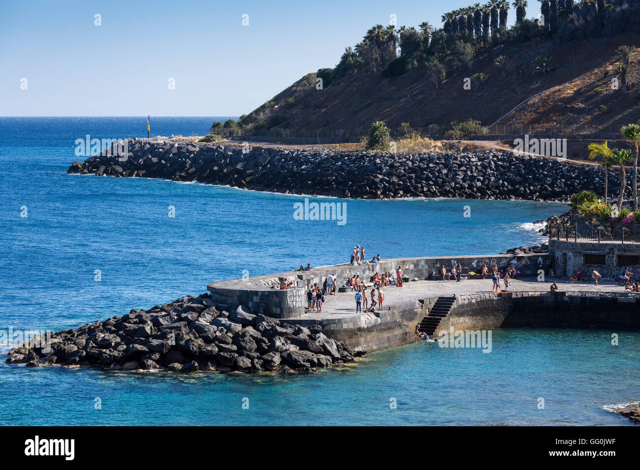 Swimmers at the small quay next to the Parque Maritimo in Santa Cruz, Tenerife, Canary Islands, Spain Stock Photo