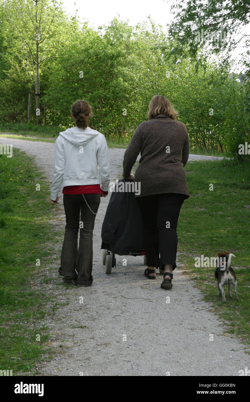 Back view teenage girl and mother adult woman behind Stock Photo