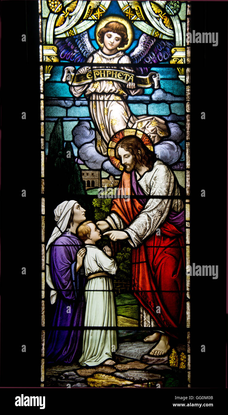 Stained glass church window depicting The Epiphany, when God revealed himself in the manifestation of Jesus Christ. Stock Photo