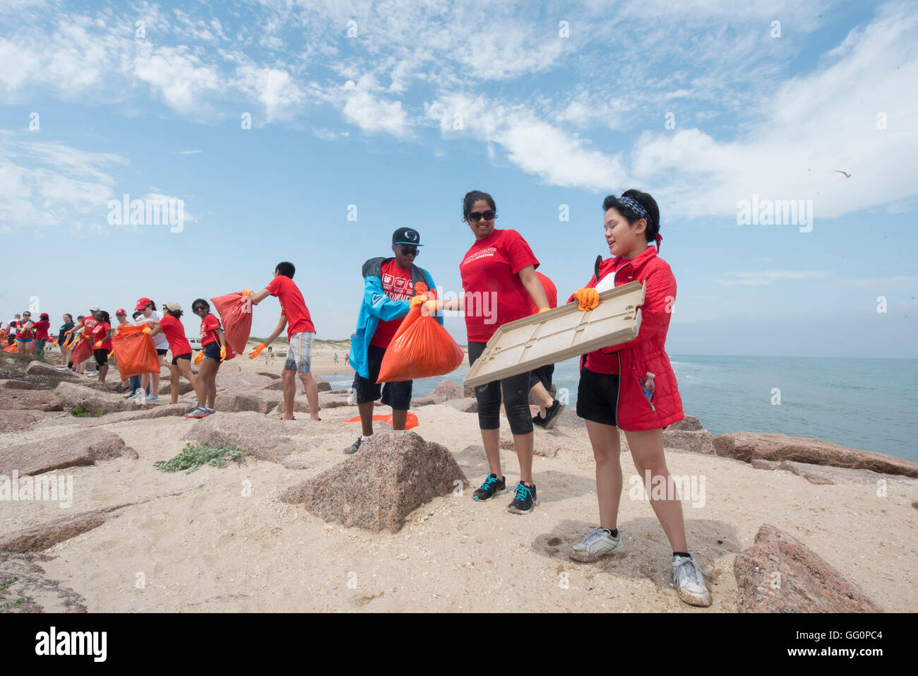 Students from the Univ. of Houston volunteer to help clean up Port Mansfield jetties in south Texas during spring break Stock Photo