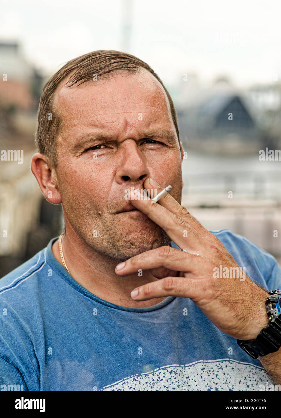 Working man Smoking a cigarette Stock Photo