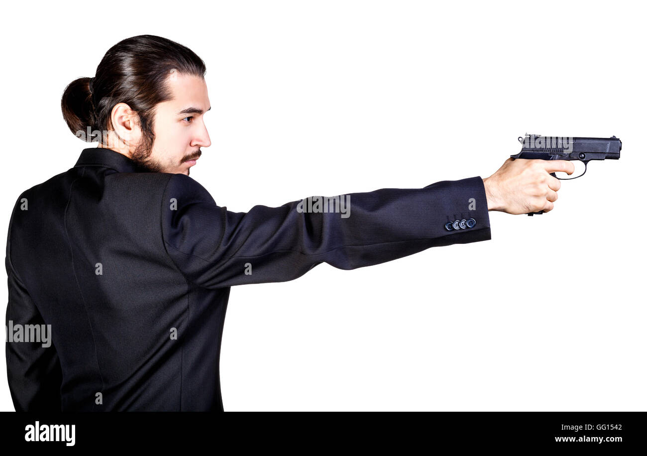 Gangster man in black suit aiming gun Stock Photo