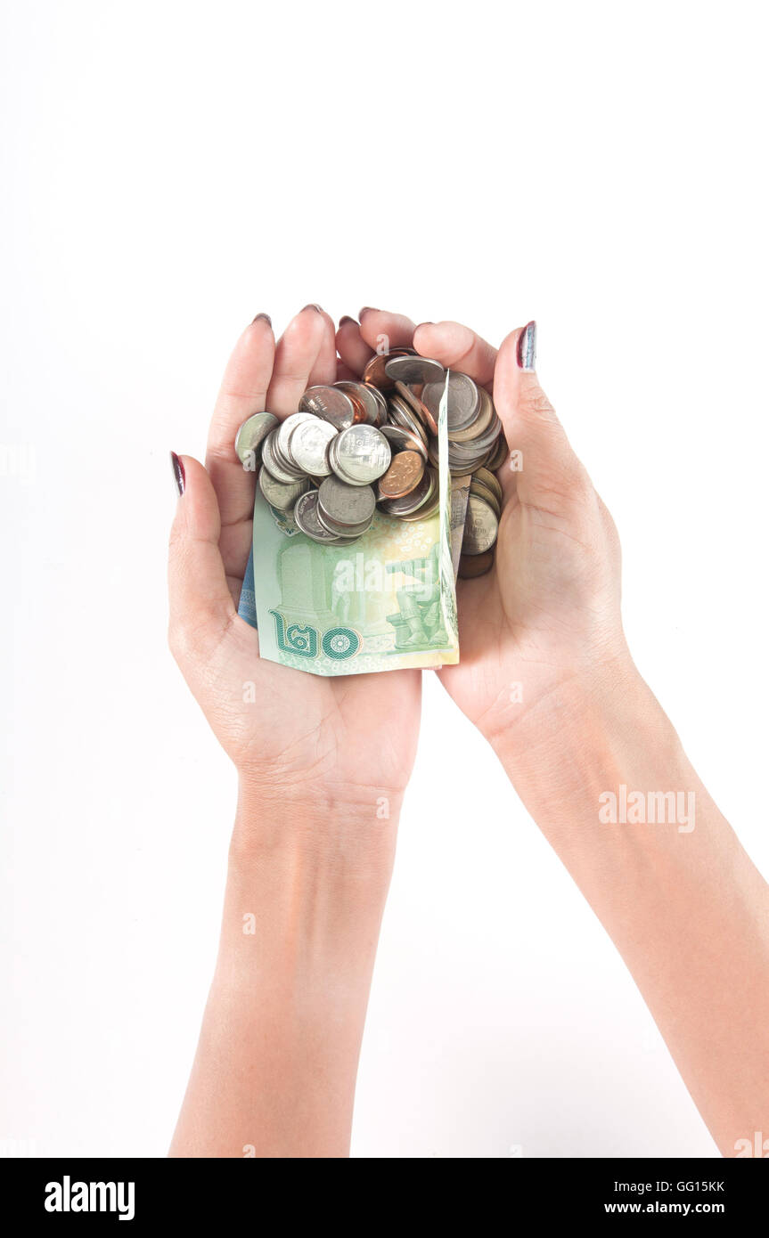 Women holds coins and banknotes of Thailand (Thai Baht, THB) Stock Photo
