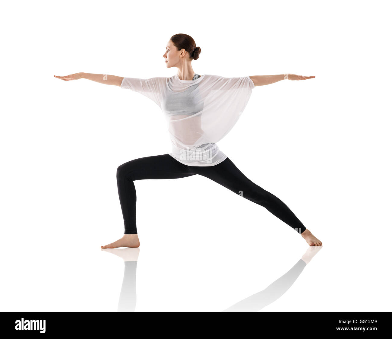 Pretty brunette woman doing yoga exercise Stock Photo
