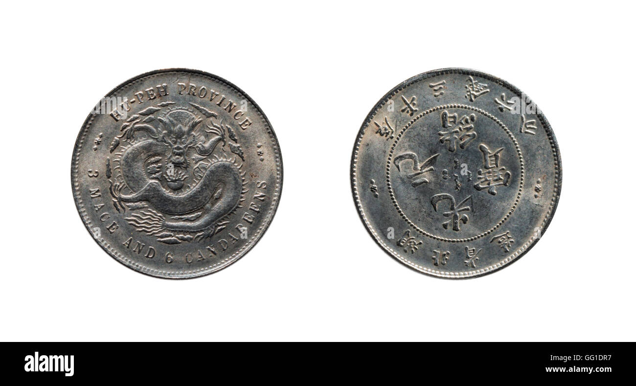 very old chinese coin with face and dragon on white background Stock Photo