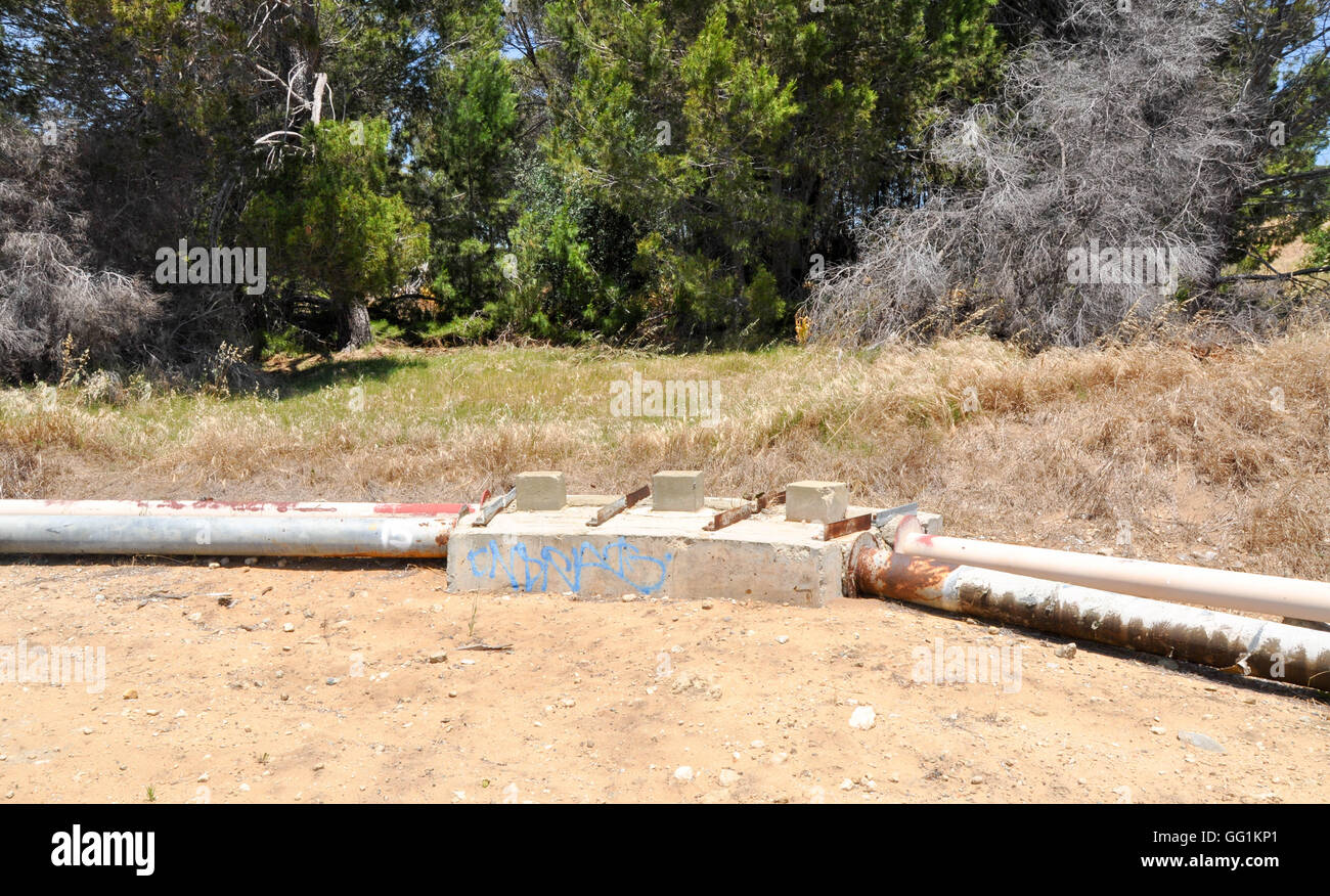 Concrete connections for ground level slurry lines in lush wetland ...
