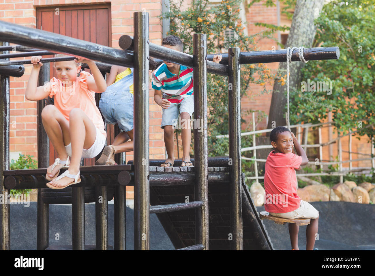 School kids playing on monkey rack Stock Photo - Alamy
