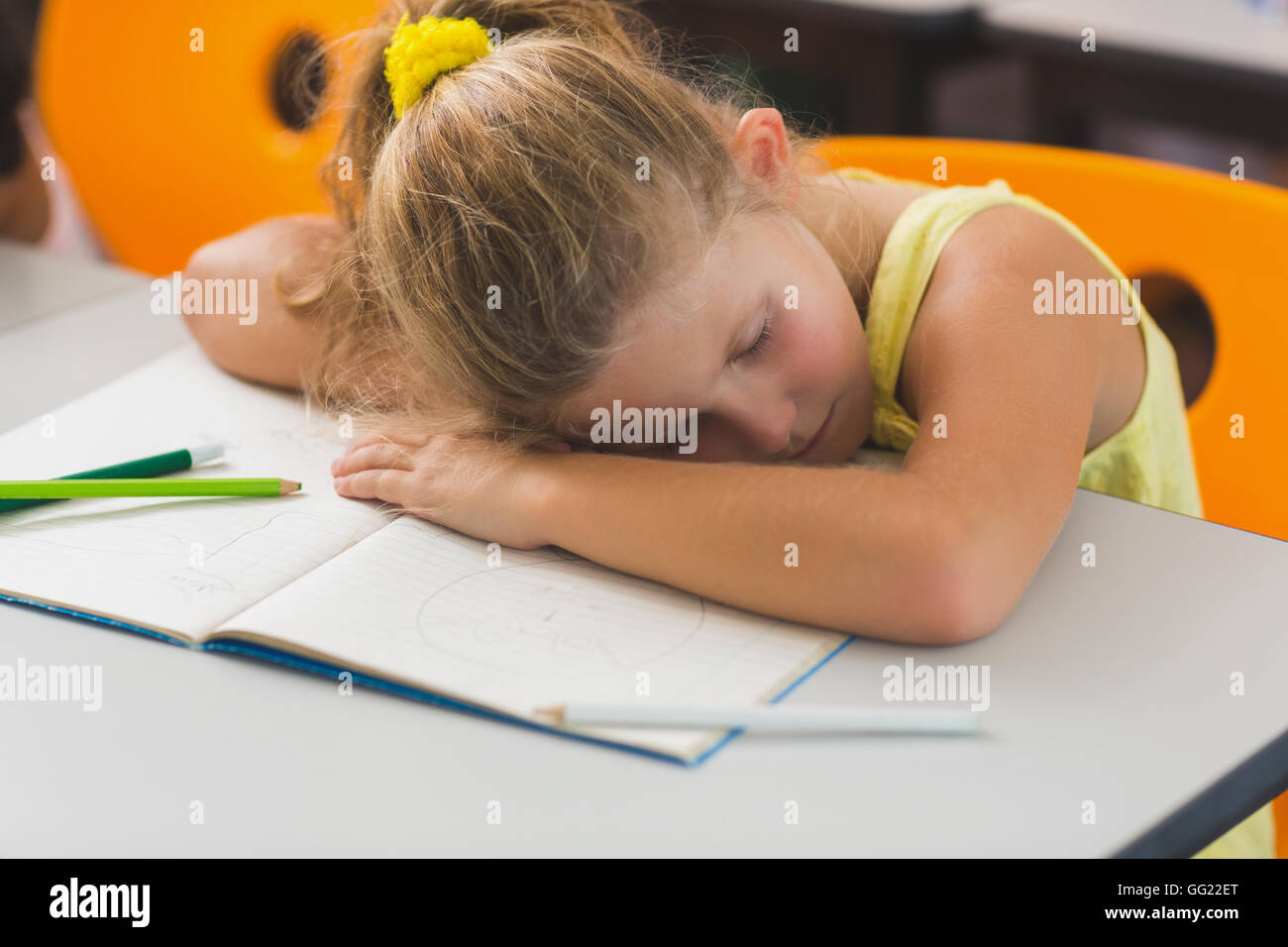 Schoolgirl sleeping at desk Stock Photo - Alamy