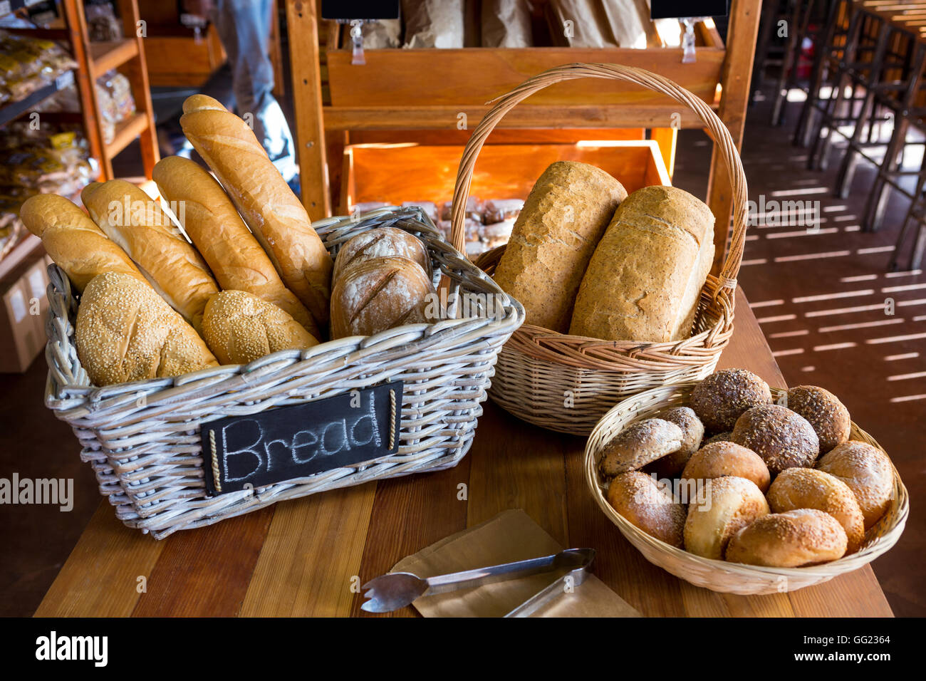 Various breads on display counter Stock Photo - Alamy