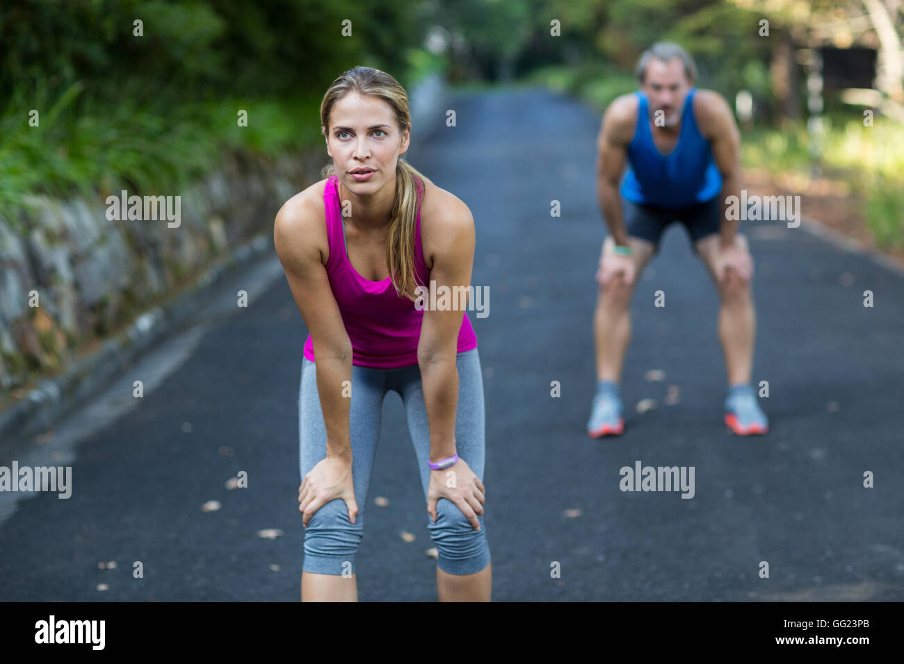 Athletic couple taking a break after jogging Stock Photo Alamy