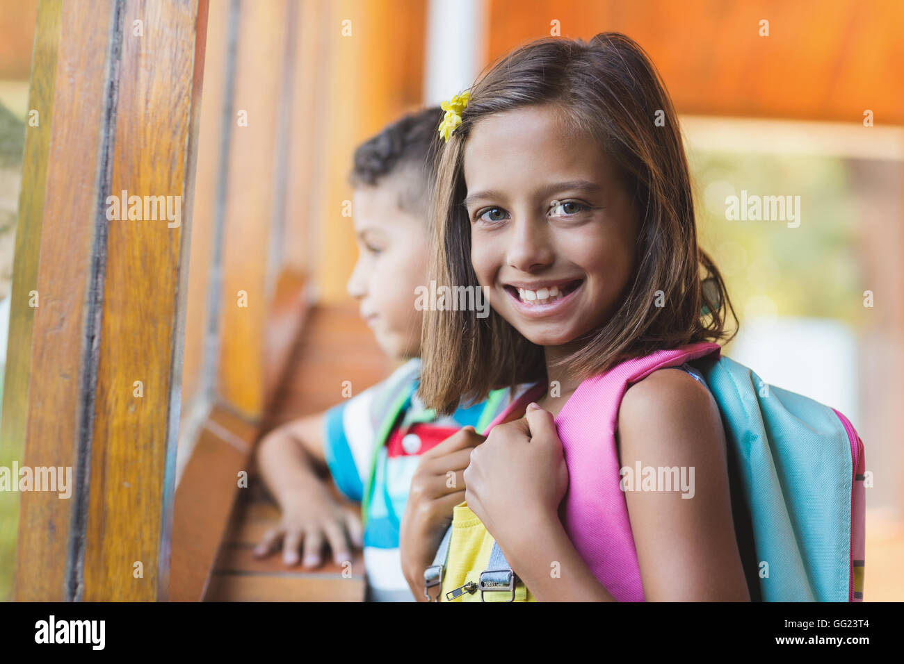 Portrait of school girl standing in school corridor Stock Photo - Alamy