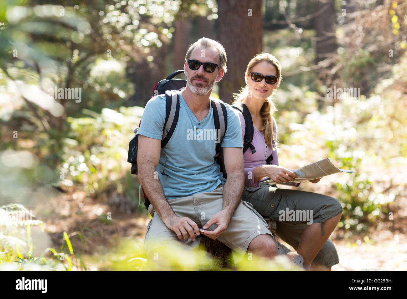 Female hiker sitting on rock hi-res stock photography and images - Alamy