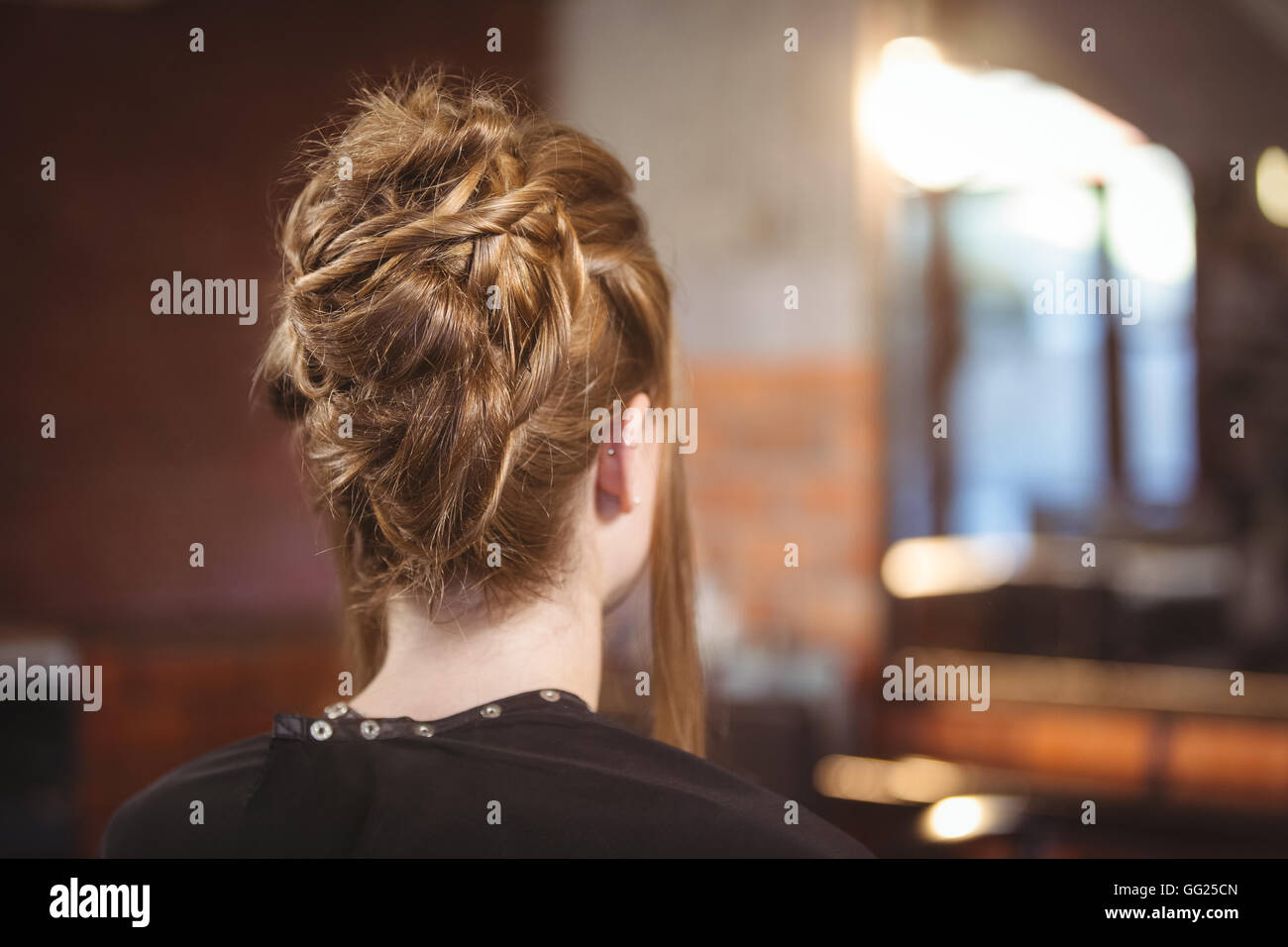 Rear view of woman with updo hairstyle Stock Photo