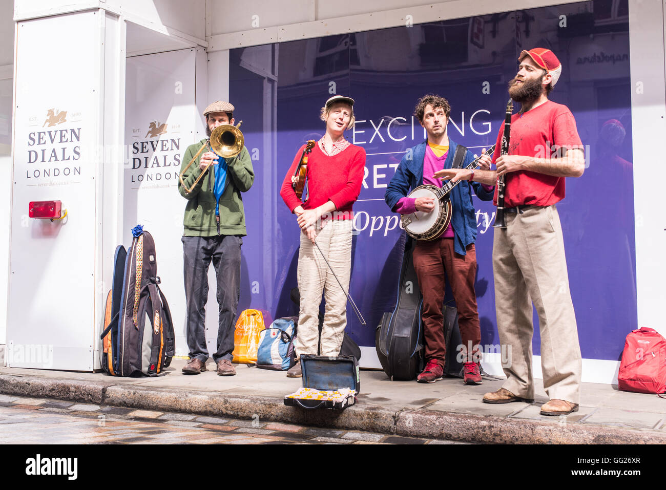 Quartet brass band busking during the Seven Dials street festival