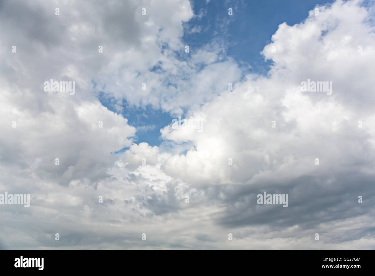 blue sky with cumulus white clouds and sun behind them Stock Photo - Alamy