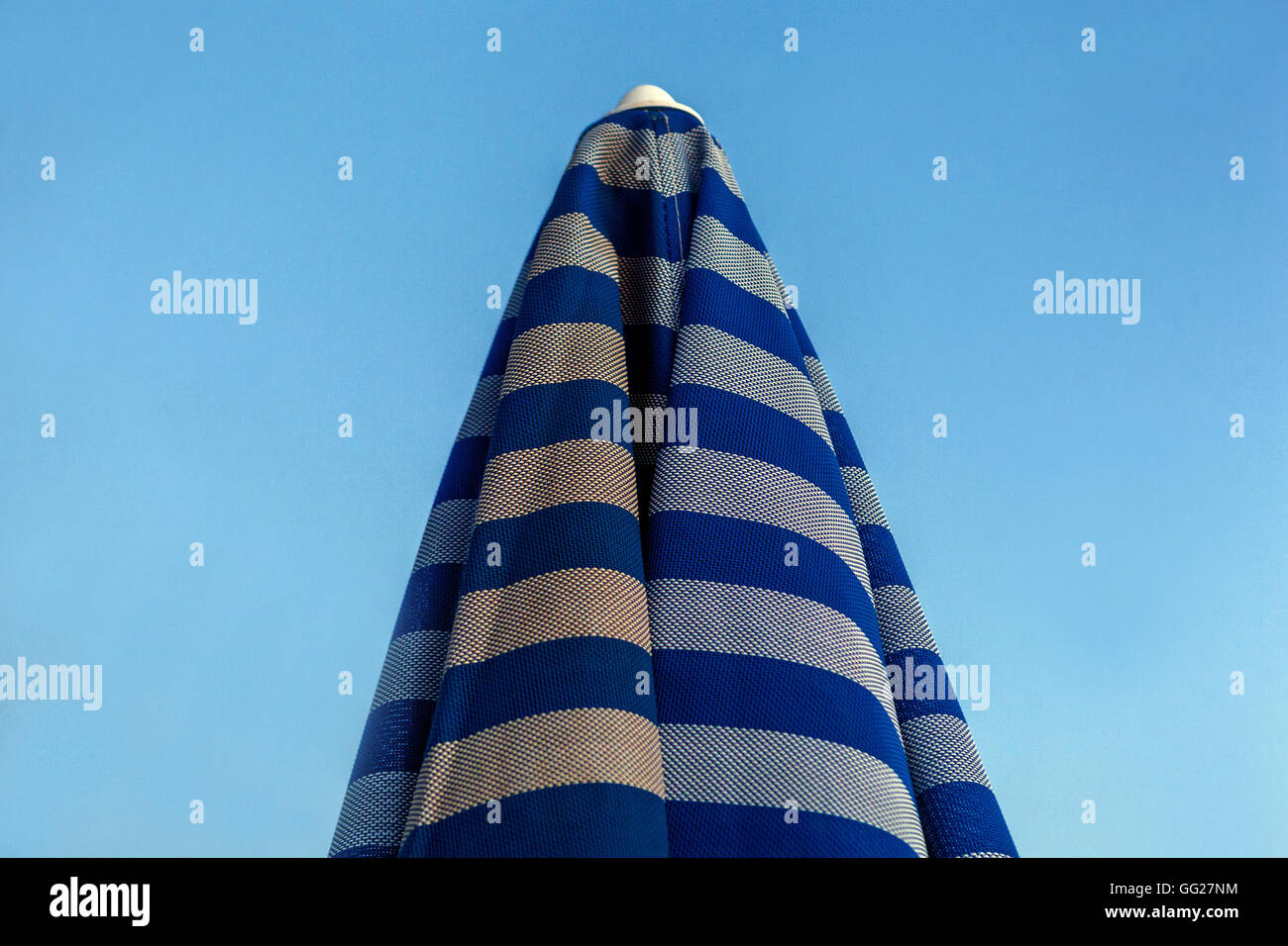 Closed Parasol Against Clear Sky Stock Photo