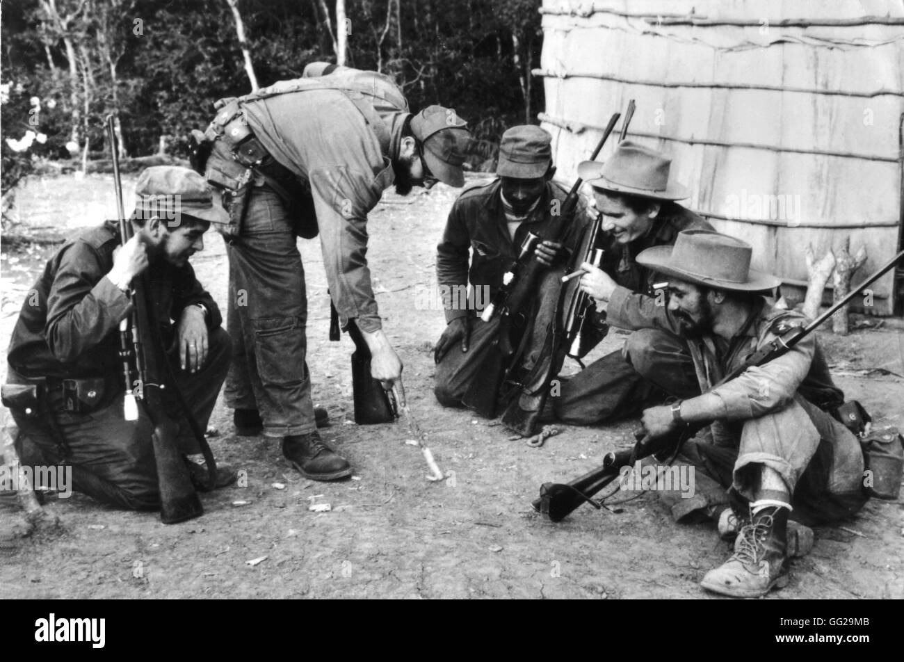 During the revolution, Fidel Castro and Che Guevara surrounded by guerillas 1956-1959 Cuba Stock Photo
