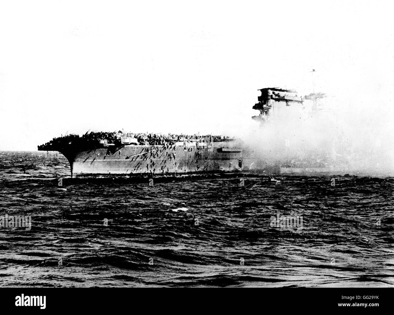 Aircraft carrier 'Saratoga' after a kamikaze attack 1944 World War II London. Imperial war museum Stock Photo