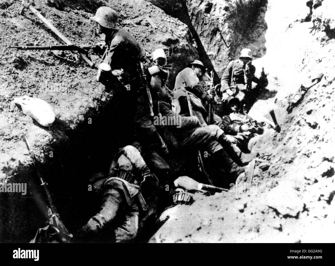 Soldiers in a trench: one is on watch while the others try to sleep Summer 1917 France - World War I Stock Photo
