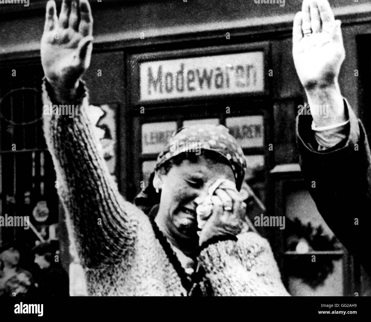 Annexation of Czechoslovakia by Germany. A Czechoslovak woman cries while performing the Nazi salute 1939 Czechoslovakia Washington. National Archives Stock Photo