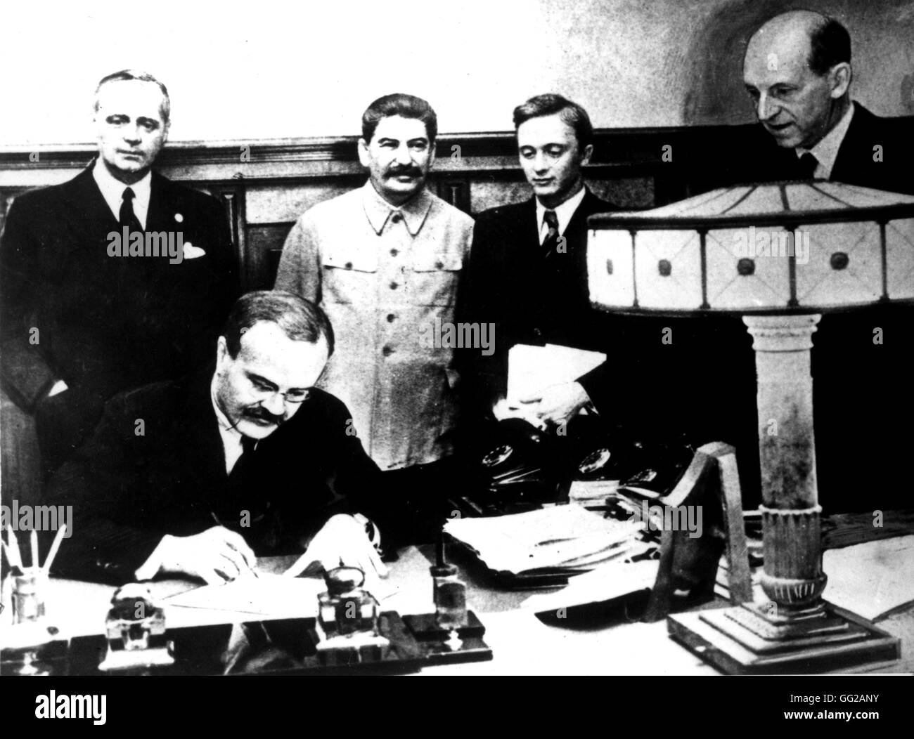 Signing of the Germano-Soviet Non-Agression Pact in Moscow. Molotov signs. Behind him, Ribbentrop and Stalin August 23, 1939 USSR - World War II Washington. National Archives Stock Photo