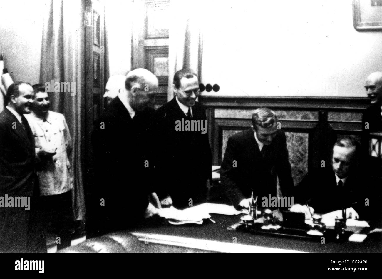 Signing of the Germano-Soviet Non-Agression Pact in Moscow. Ribbentrop signs. (Also seen: Stalin and Molotov) August 23, 1939 USSR - World War II Washington. National Archives Stock Photo