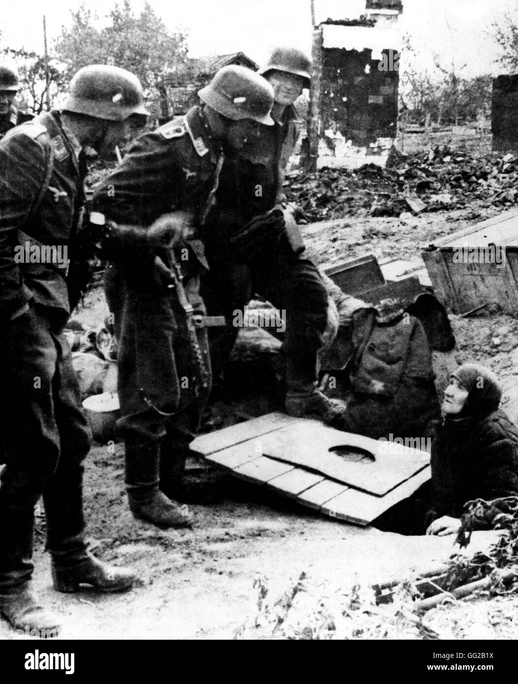 German soldiers surprised to find this old Russian lady in a hideout instead of finding Russian soldiers, Stalingrad November 18, 1942 USSR, Second World War war National archives, Washington Stock Photo