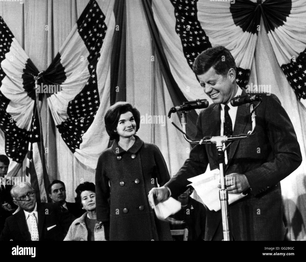 Jacqueline Kennedy is showing happiness and satisfaction as she is looking at the new President, John Kennedy, who is addressing the meeting, after waiting all night long for the election results. November 1960 United States National archives. Washington Stock Photo