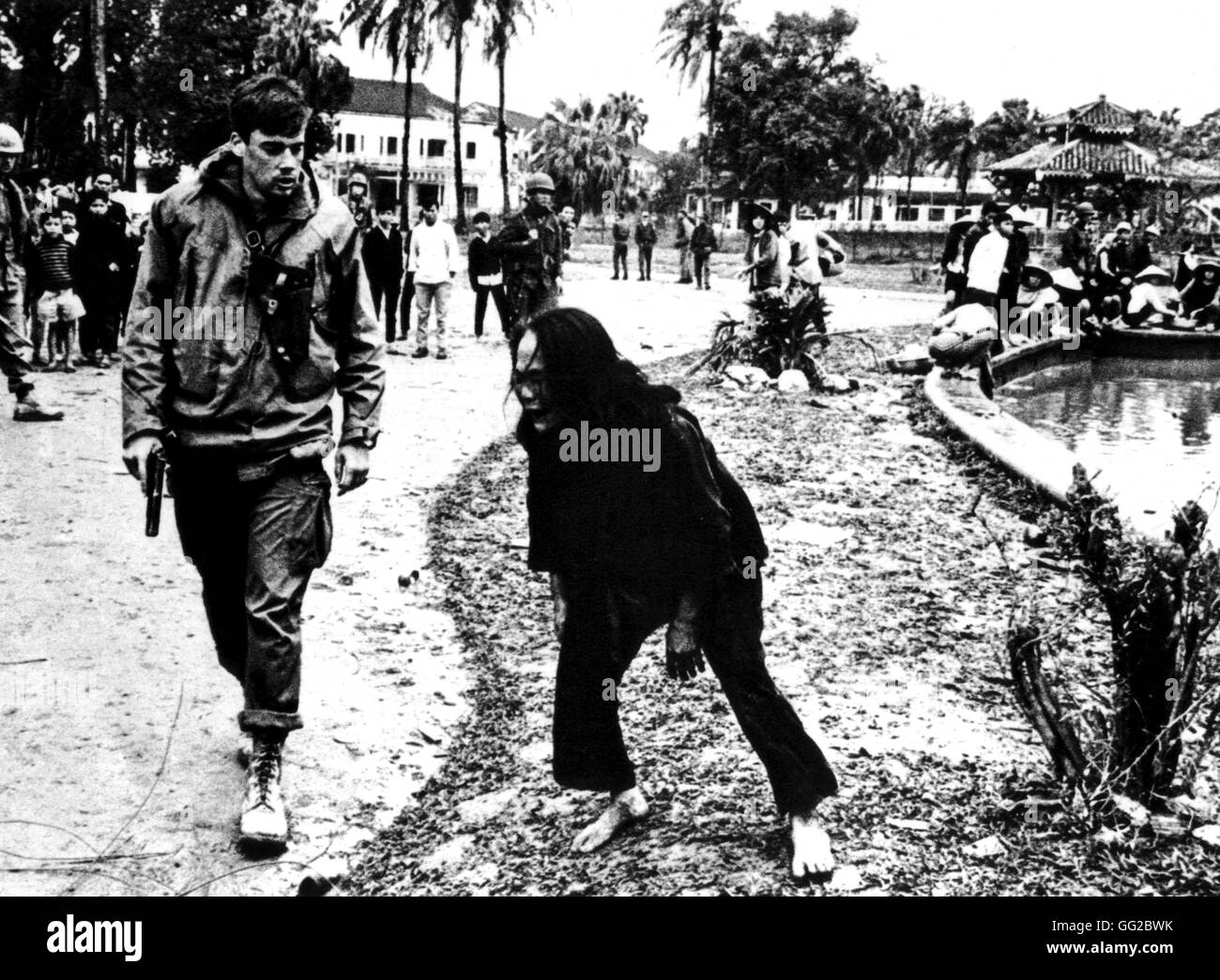 A Vietnamese woman, Cong-Hoa, implores an American soldier to have pity on his son, arrested in error as a Vietcong 20th century Vietnam war Stock Photo