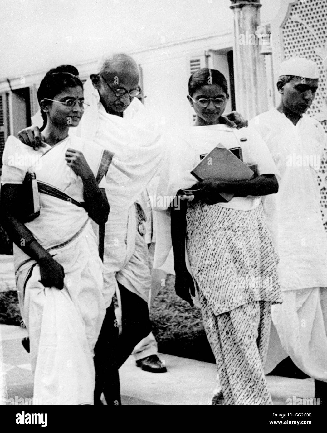 Gandhi surrounded by his daughters 20th century India National Archives. Wahington Stock Photo