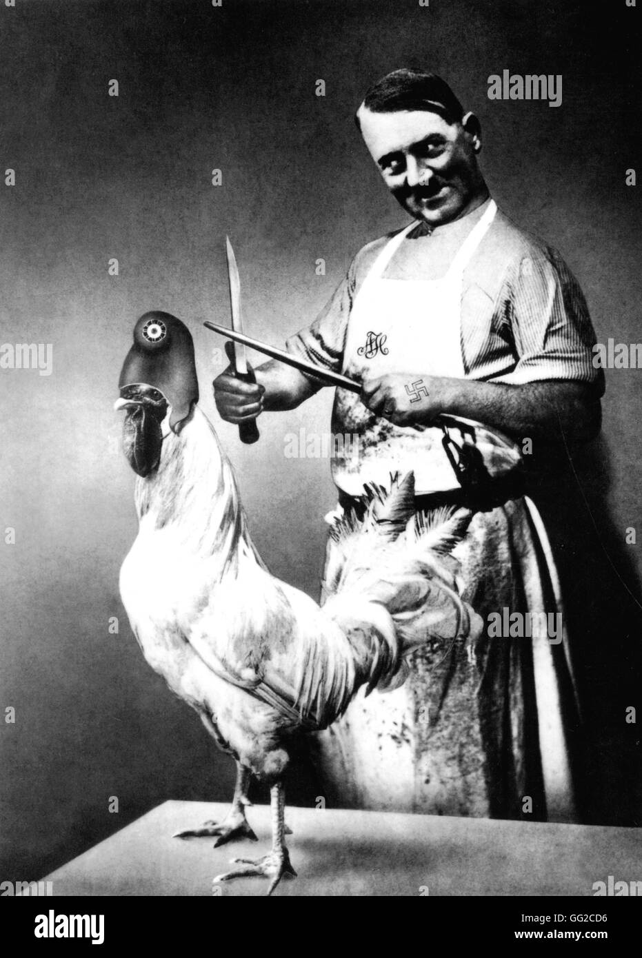 Photomontage by John Heartfield in 'Regards' du 7 mai 1936: 'Have no fear, he's a vegetarian'. With this words, French minister for Foreign Affairs Mr Laval was trying to reassure Frech civilians (Hitler and the Gallic rooster) 1936 Germany Stock Photo