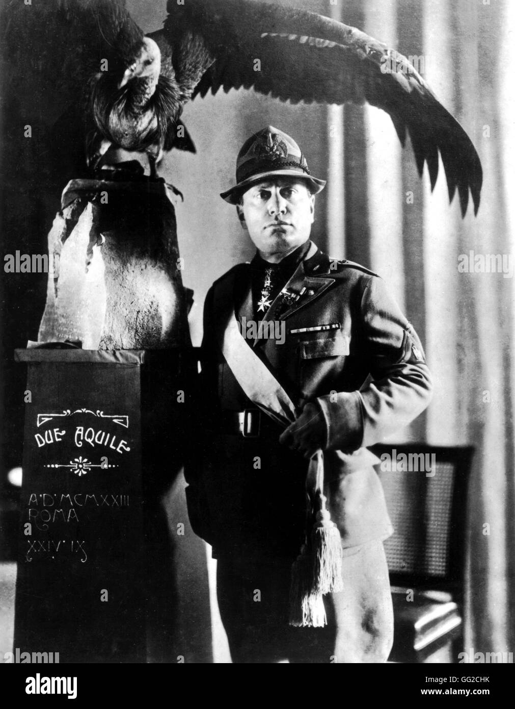 Mussolini dressed in his new lance corporal uniform posing with an eagle captured by Sardinian peasants 1931 Italy Stock Photo