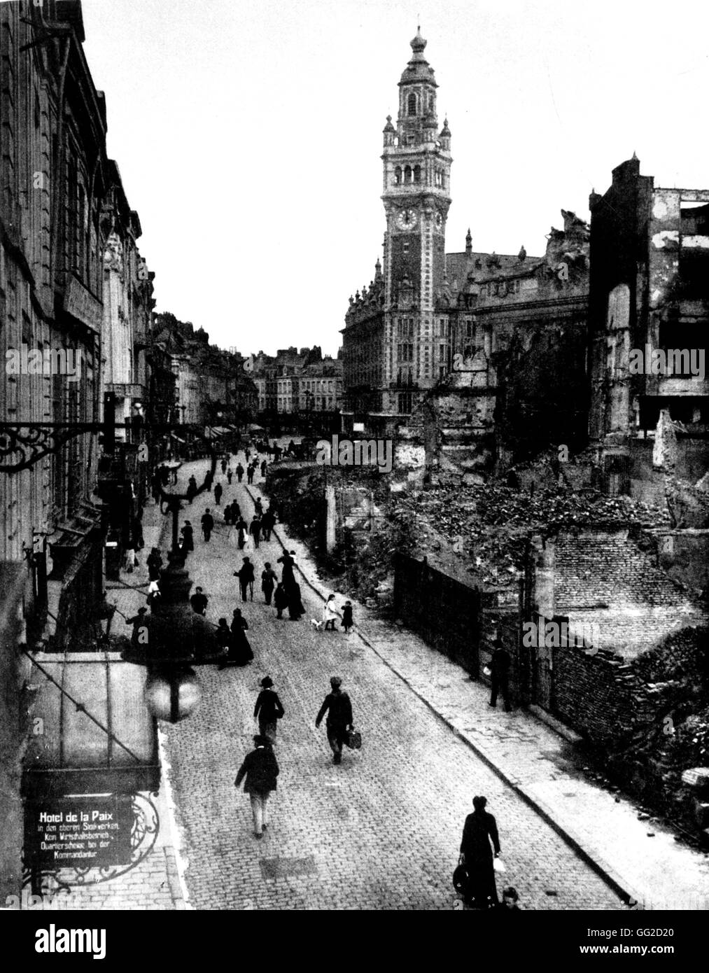Under the German occupation in France: the destroyed city of Lille. On the left corner, poster in front of the hotel de la Paix transformed into the Kommandantur headquarters France - World War I B.D.I.C. Stock Photo