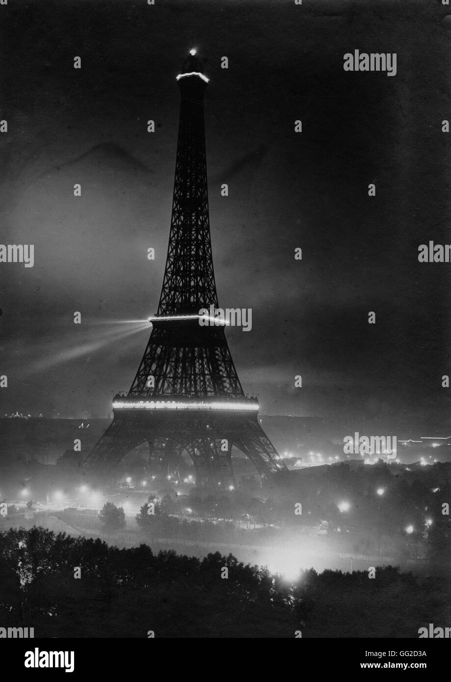 Illuminated Eiffel Tower in the night of July 14, 1919 Stock Photo