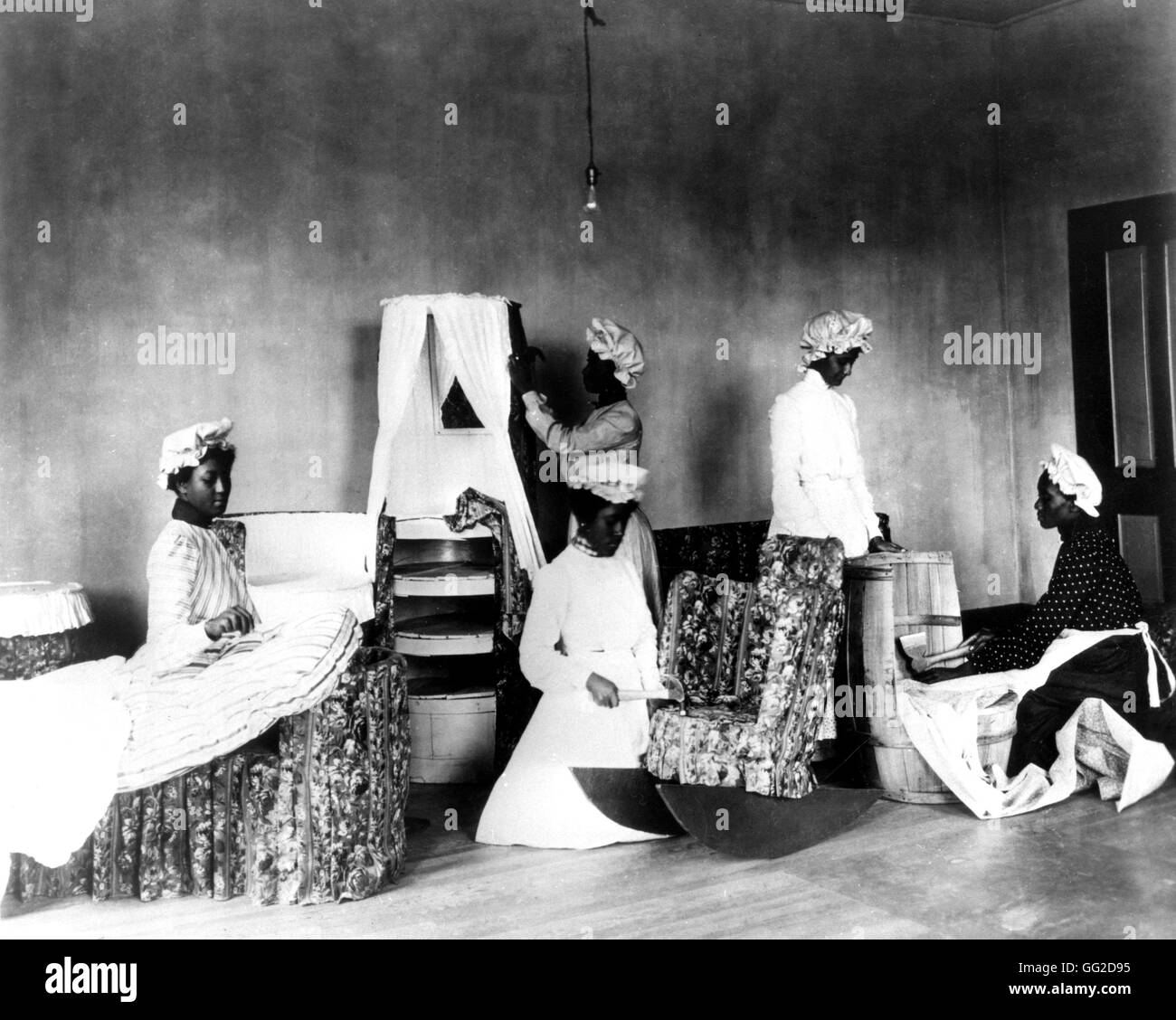 Photo by J.B. Johnston. Black students during a decoration and fashion design course 1903 United States Washington. Library of Congress Stock Photo