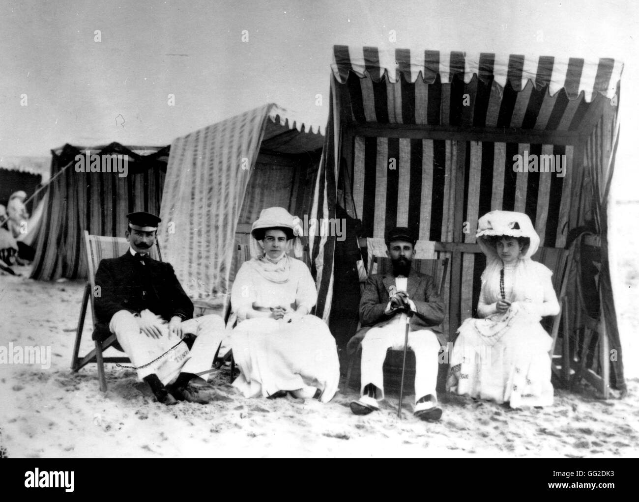 Wealthy couples spending their holidays at seaside About 1900 France Stock Photo