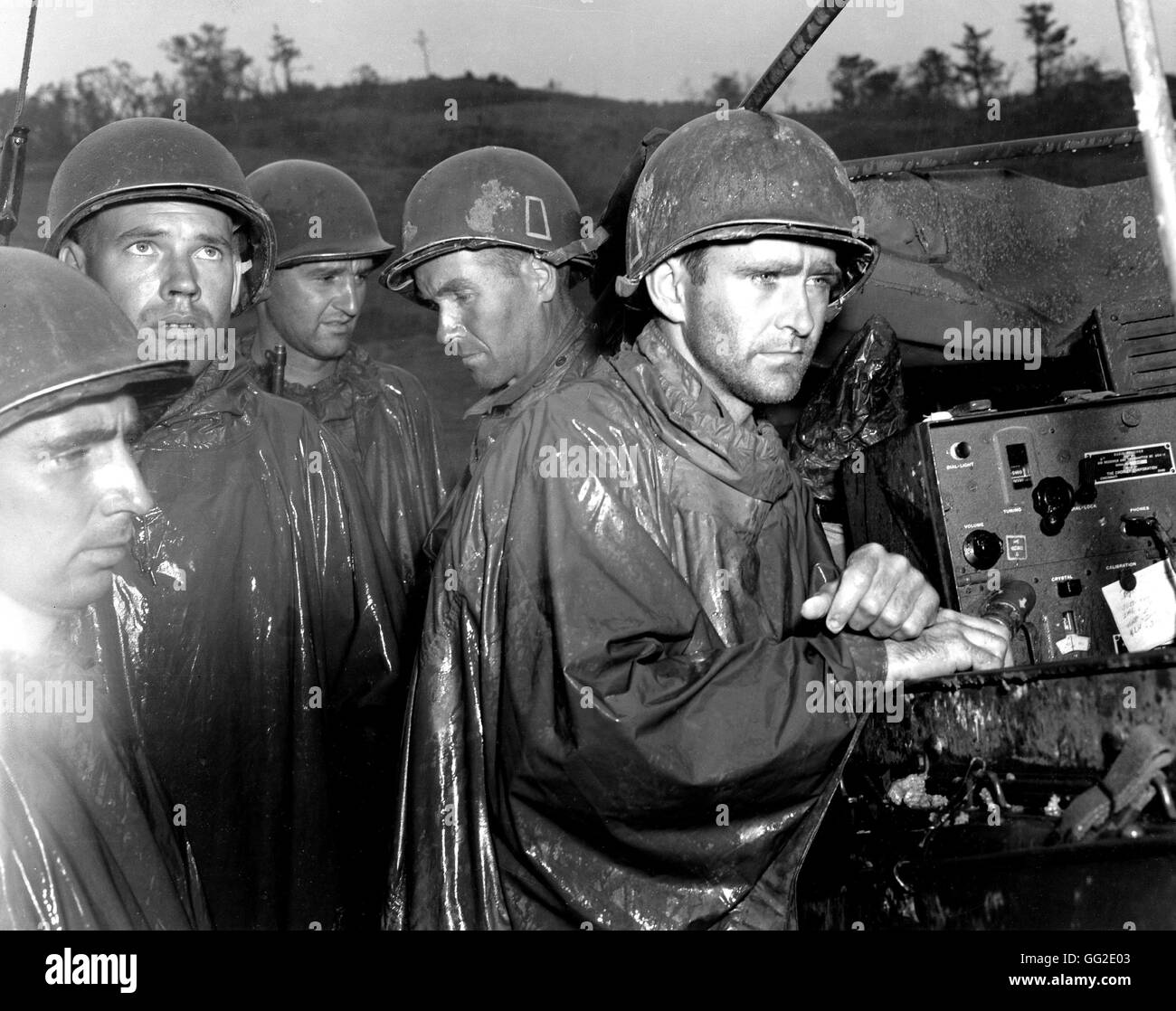War in the Pacific Okinawa 'Death Valley'.  US soldiers of the 77th infantry division, learning the German surrender of May 8, 1945, on radio. May 10, 1945 Japan - World War II National archives, Washington Stock Photo