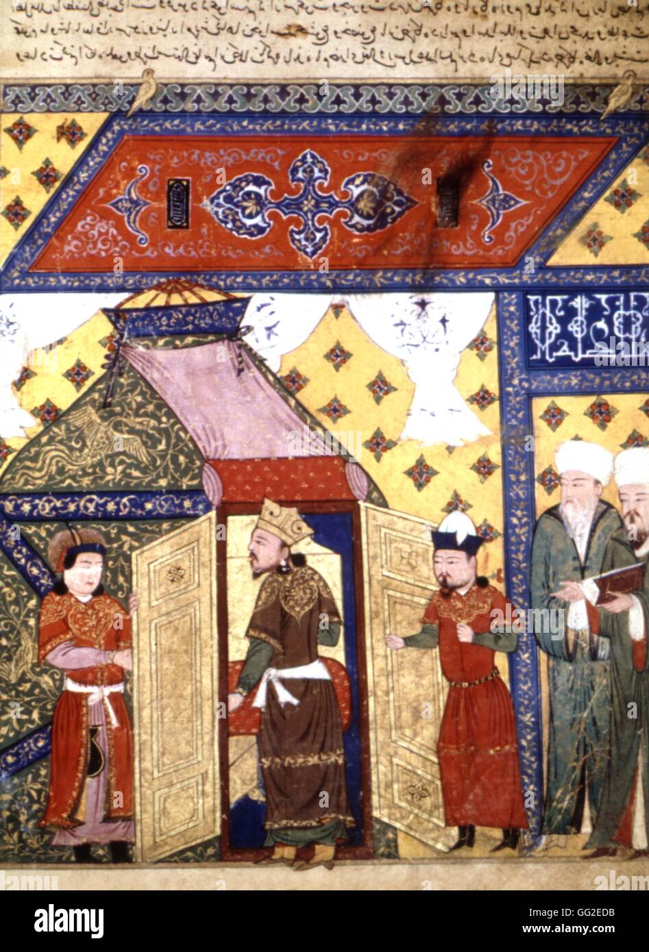 Persian manuscript illustrated with 106 paintings: 'Jami'al Tawarikh' by Rachid ad-Dîn (History of the Mongols). Ghazan Khan's tent. Inside a golden throne, a Muslim reading the Koran. Persian school 14th century Stock Photo