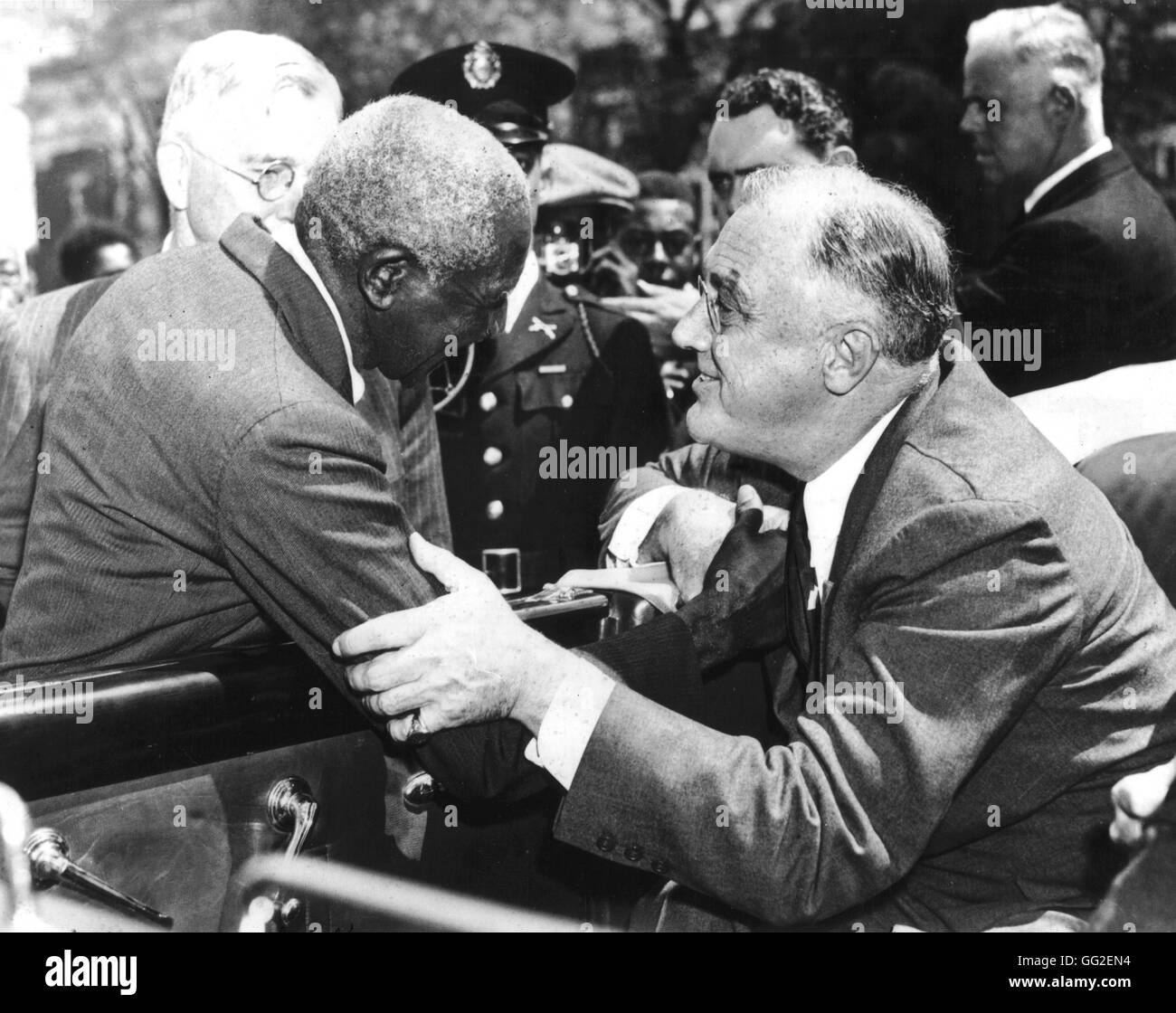 At Tuskegee institute, a black school founded by Booker T. Washington, Roosevelt is shaking hands with professor G.W. Carver, an eminent scientist in the field of agriculture. c.1935 United States Stock Photo