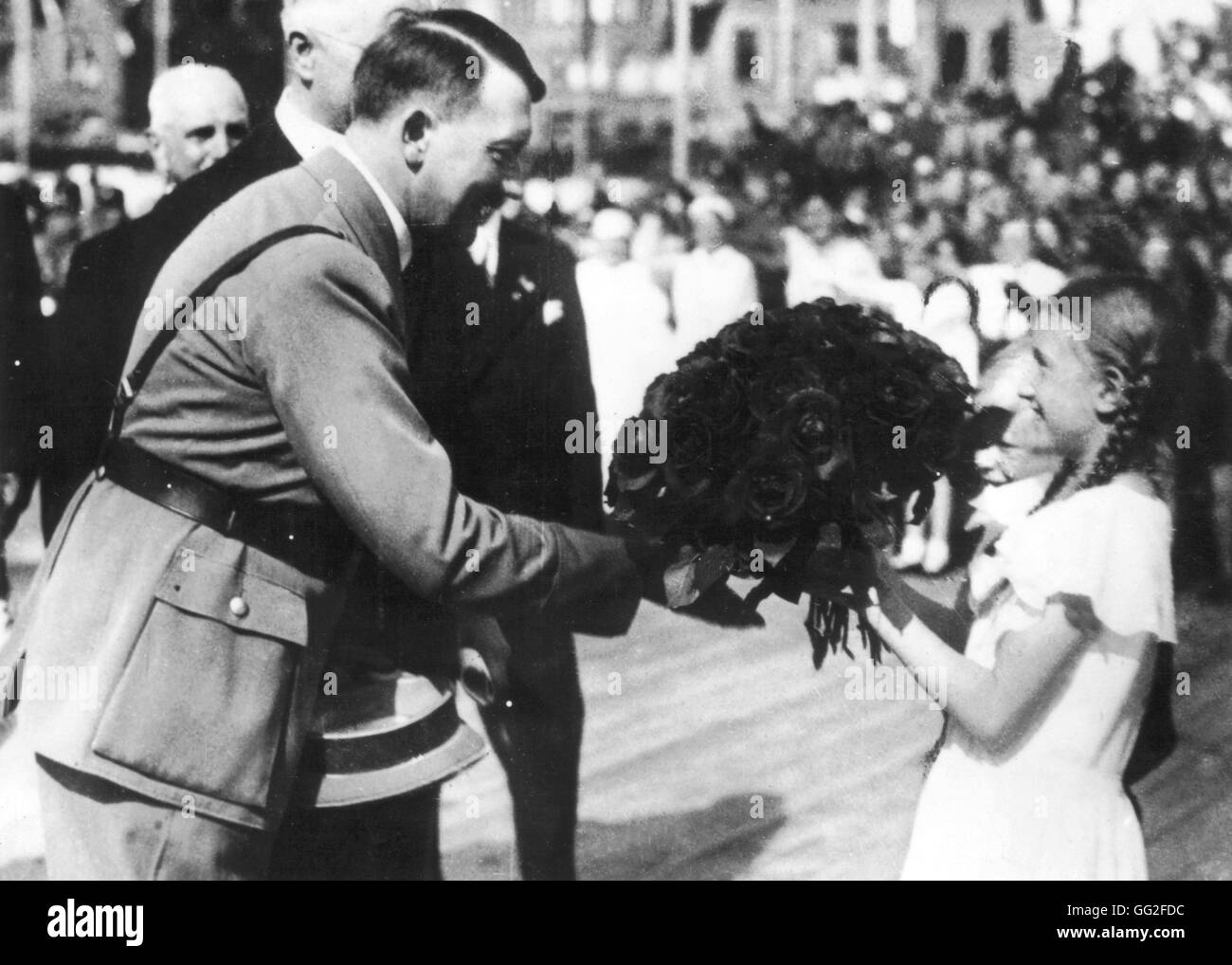 April 20, 1936, a young girl is offering Hitler a bunch of flowers for his 47th birthday April 20, 1936 Germany Stock Photo