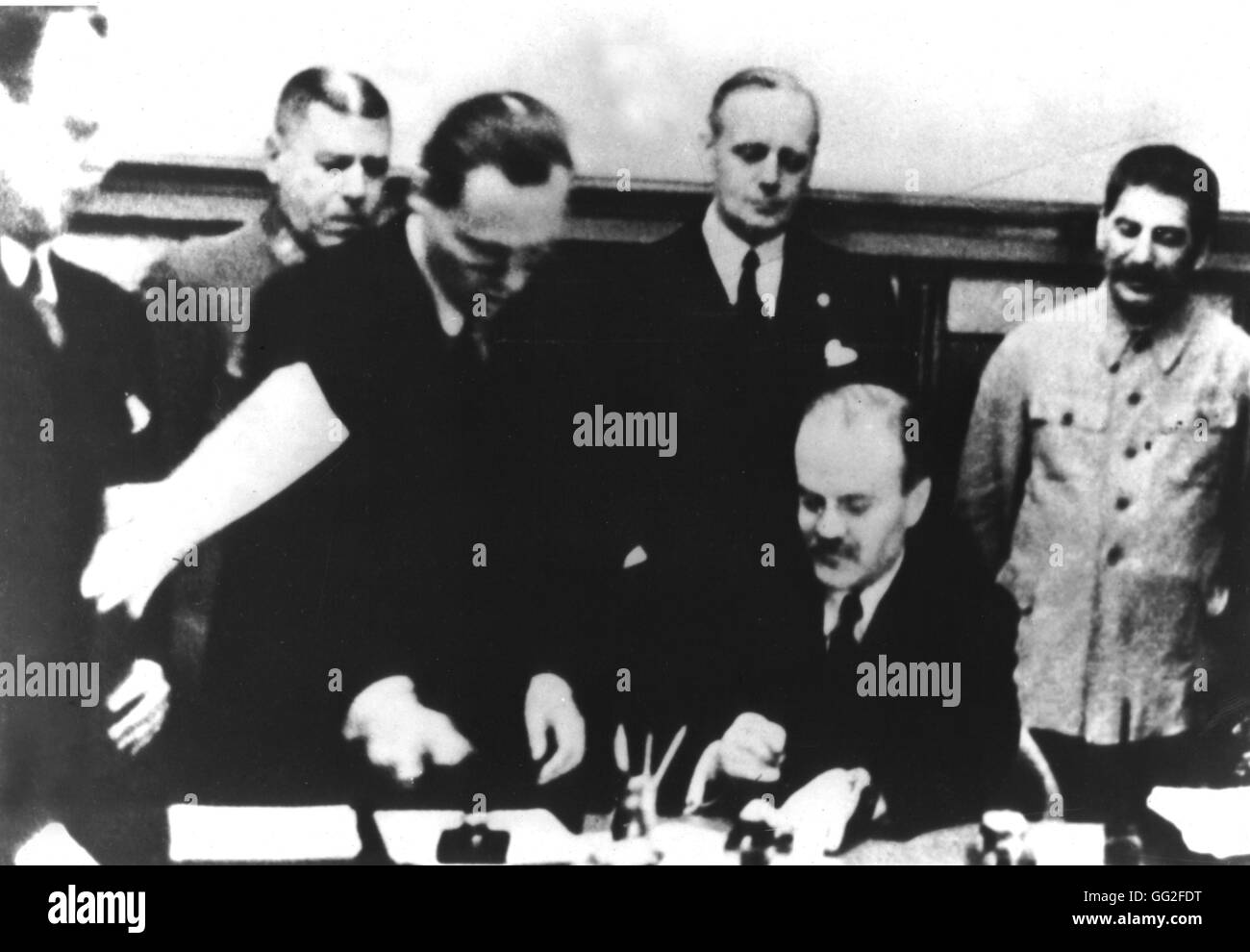 Signature of the German-Soviet nonagression pact in Moscow - August 23, 1939. Molotov is signing. Behind him, Ribbentrop and Stalin USSR, WWII Stock Photo