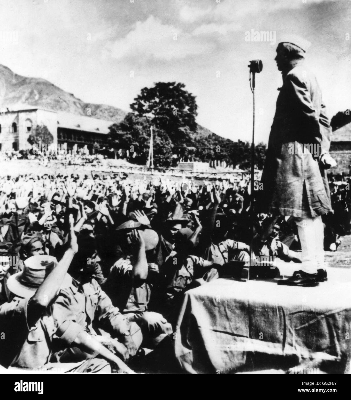 During a visit to Kashmir, prime minister of India, Pandit Nehru, delivered a speech to Indian troops of the area. Here he stands, at the right, during his speech June 27, 1949 India - Kashmir National Archives - Washington Stock Photo
