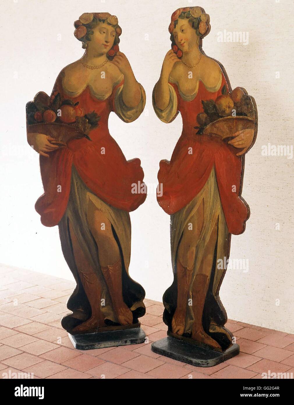 Two silhouetted female figures. French School. Painted wood panels serving as fire screen, each 129 x 50 cm. Stock Photo